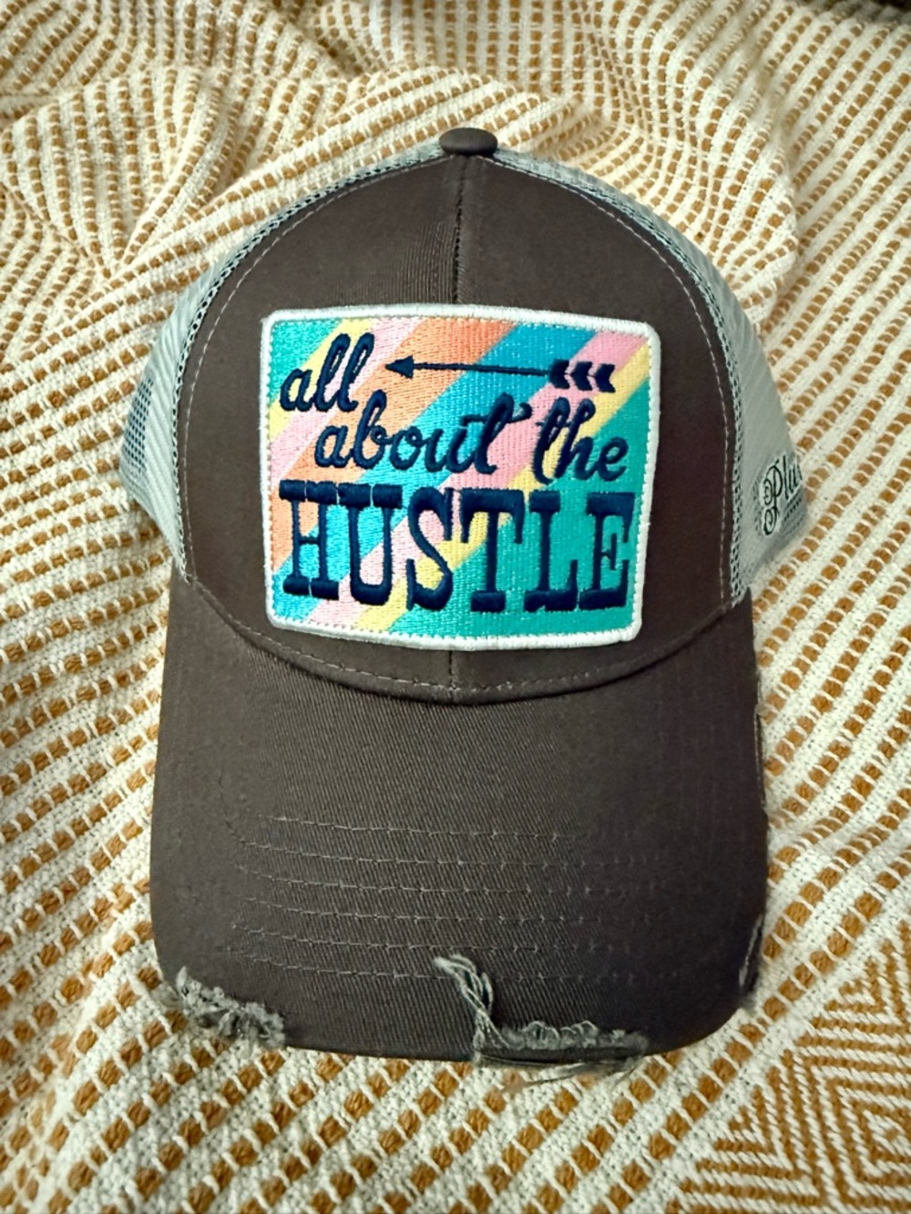 Plunder Mesh Trucker Hat with Colorful 'All About The Hustle' Patch